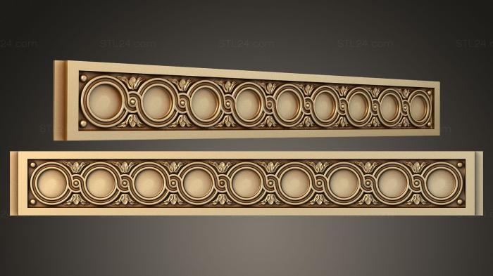 Carved frieze on the fireplace with circles