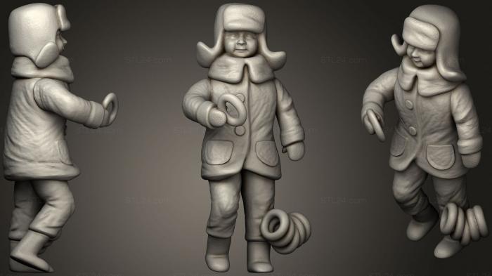 Мальчик в зимней куртке и шапке с сушками 25