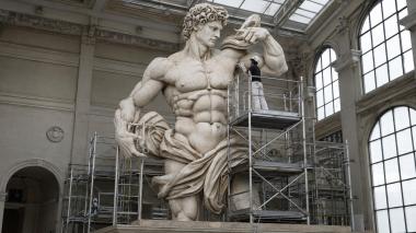 Statues of men Michelangelos David sculpture with scaffolding 3D model 3d model